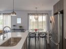 Kitchen and dining room of the model condo at Le Haut Corbusier Laval